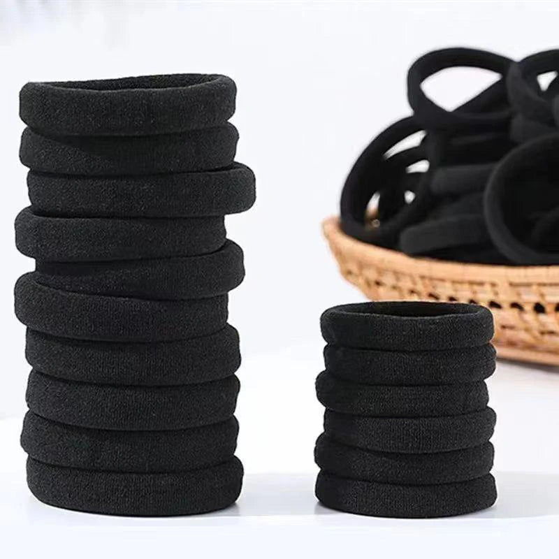 Set of 50/100 black elastic hair ties, durable and stretchable ponytail holders for everyday use.