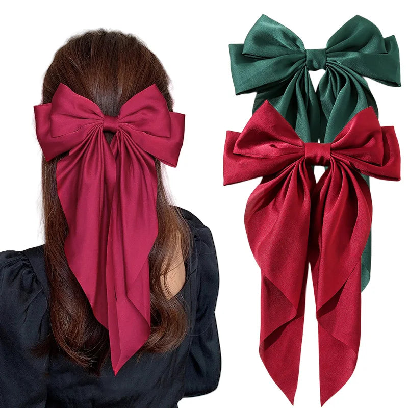 Elegant satin bow hair clip with strong hold and soft feminine style.