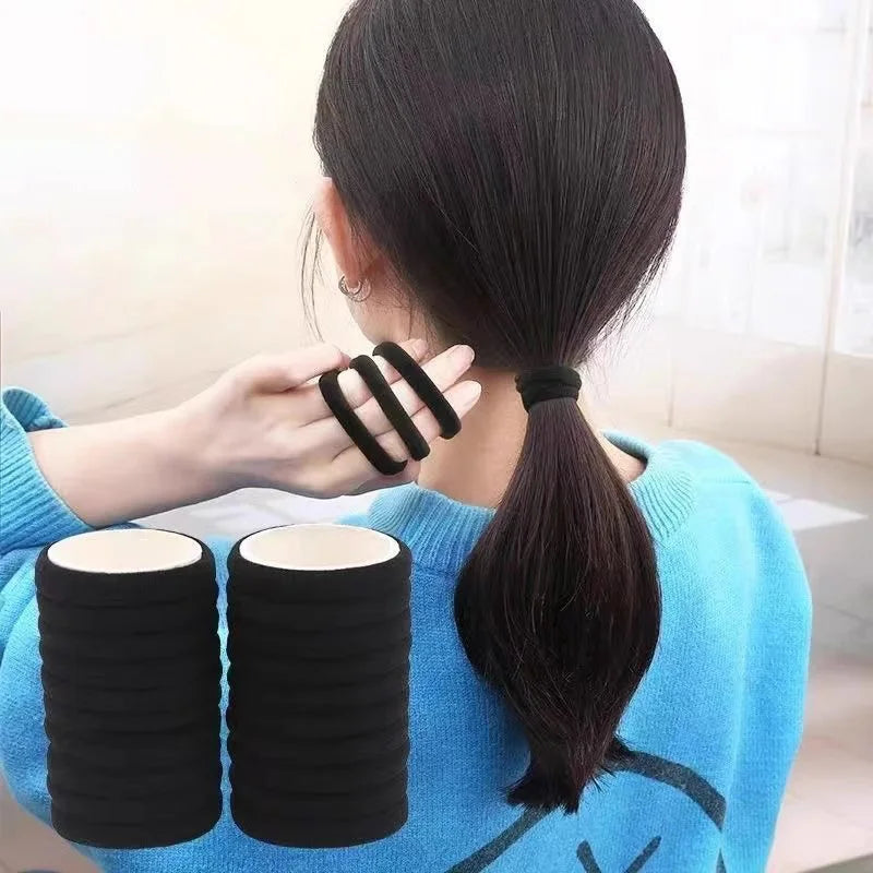 Set of 50/100 black elastic hair ties, durable and stretchable ponytail holders for everyday use.