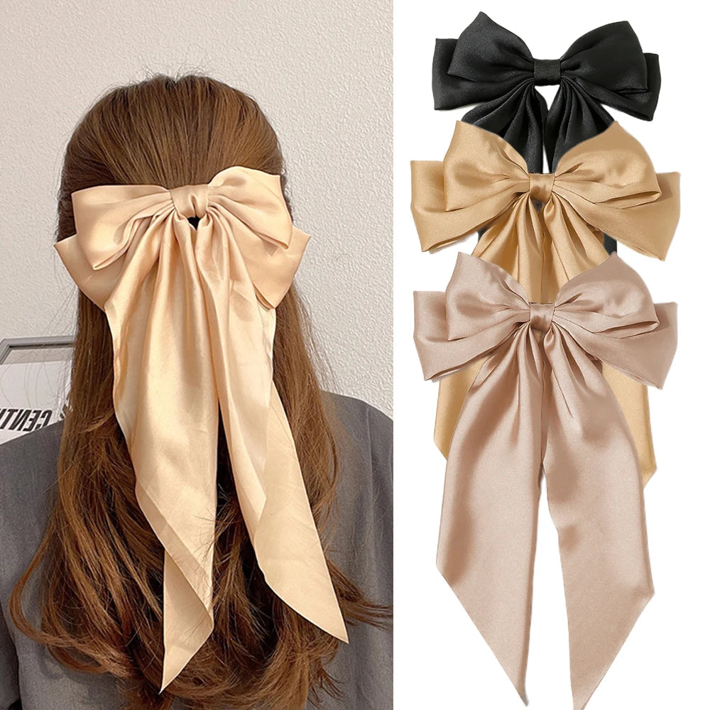 Elegant satin bow hair clip with strong hold and soft feminine style.