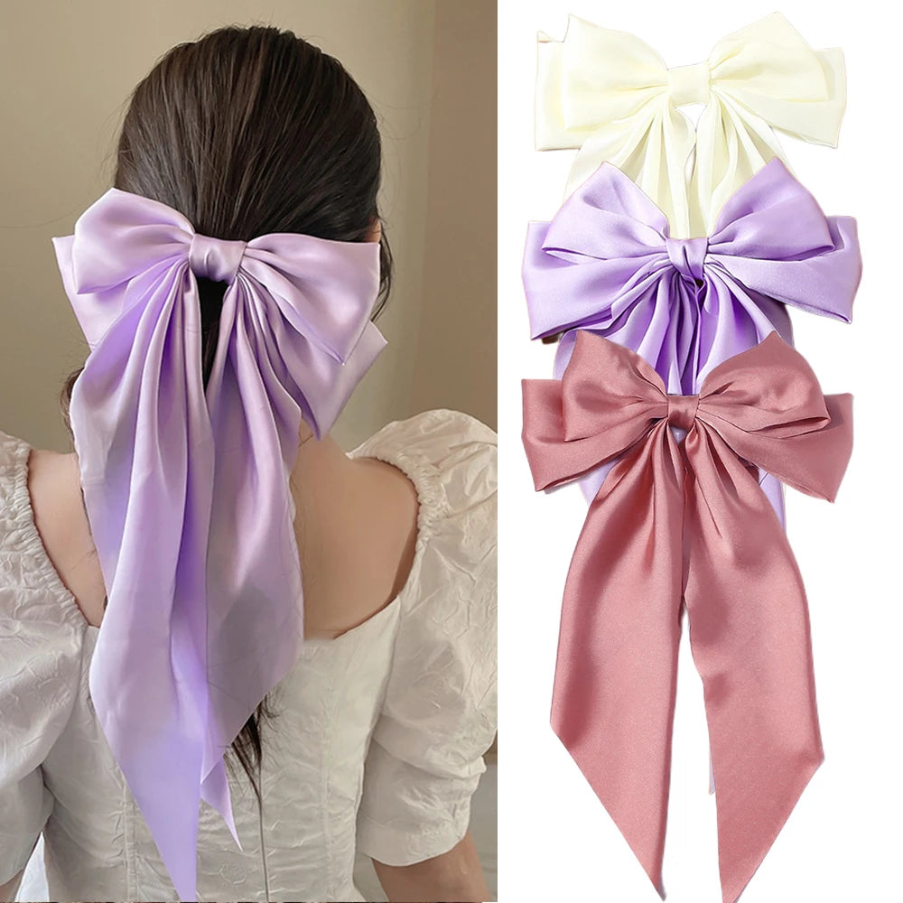 Elegant satin bow hair clip with strong hold and soft feminine style.