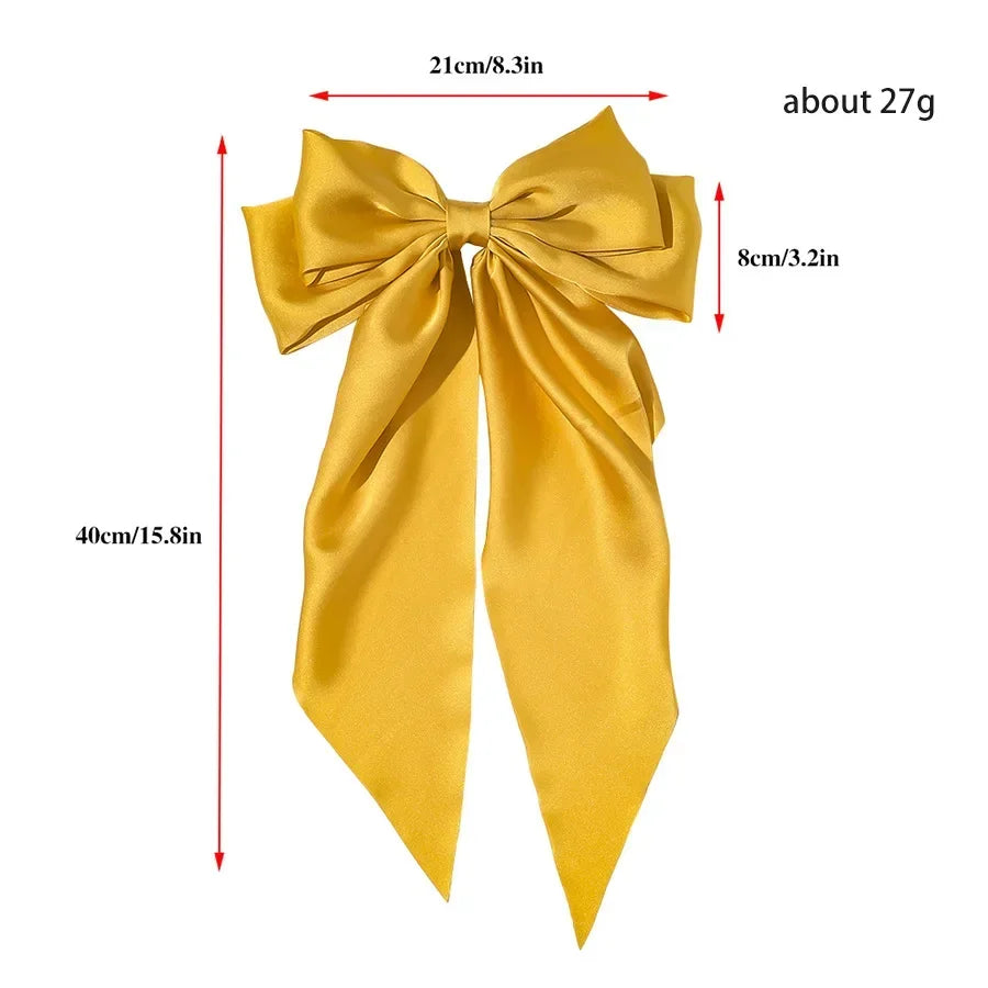 Elegant satin bow hair clip with strong hold and soft feminine style.