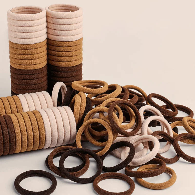 Set of 50/100 black elastic hair ties, durable and stretchable ponytail holders for everyday use.