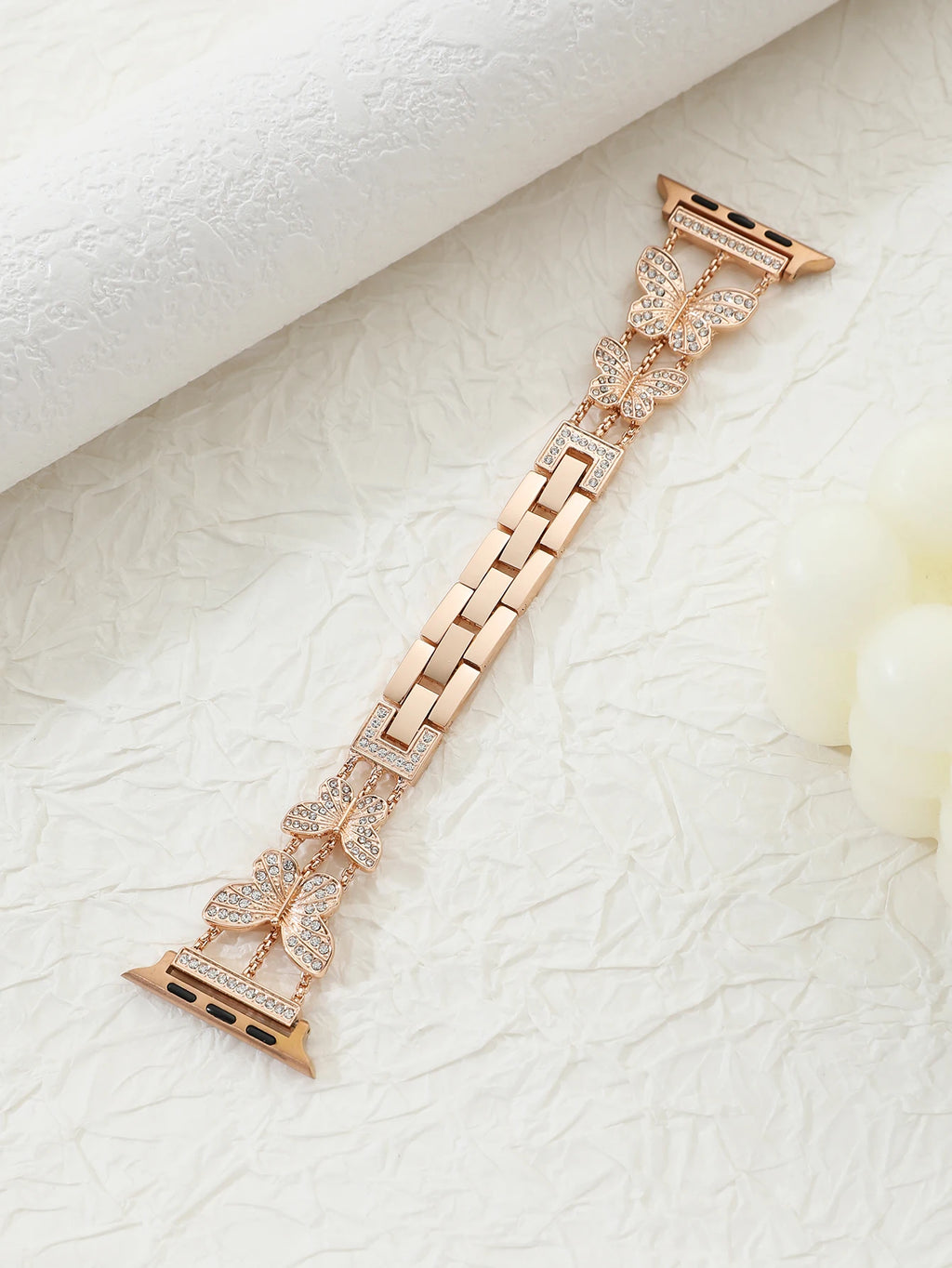 Shiny butterfly metal strap for Apple Watch with a stylish luxury look, fits multiple sizes and series.