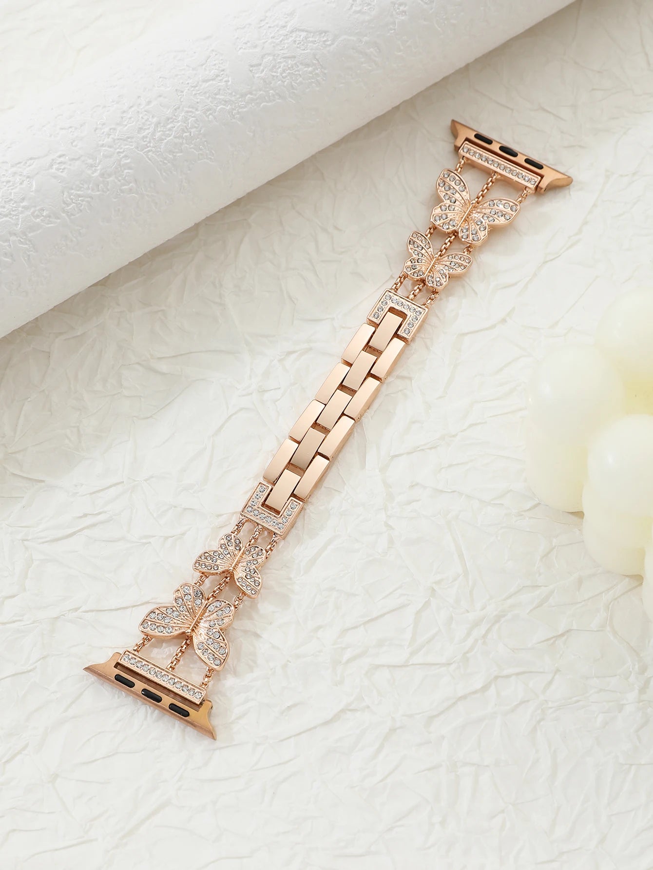 Shiny butterfly metal strap for Apple Watch with a stylish luxury look, fits multiple sizes and series.