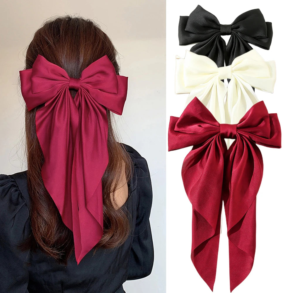 Elegant satin bow hair clip with strong hold and soft feminine style.