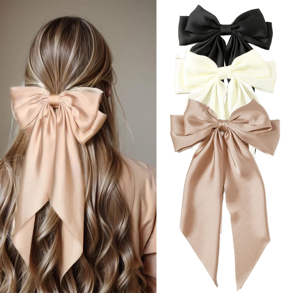 Elegant satin bow hair clip with strong hold and soft feminine style.