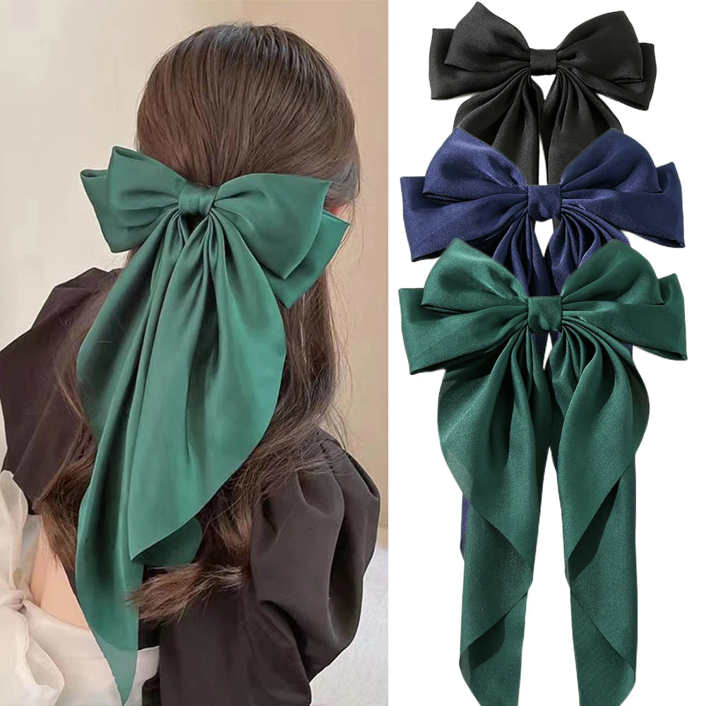 Elegant satin bow hair clip with strong hold and soft feminine style.