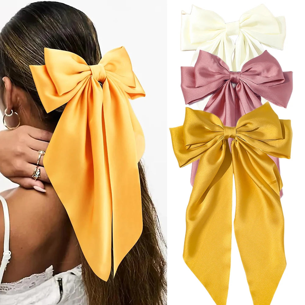Elegant satin bow hair clip with strong hold and soft feminine style.